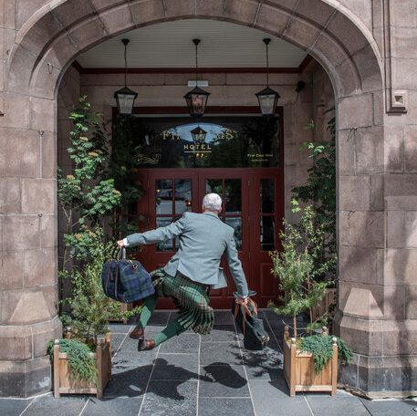 A jumping Ghillie outside the Fife Arms hotel in Braemar